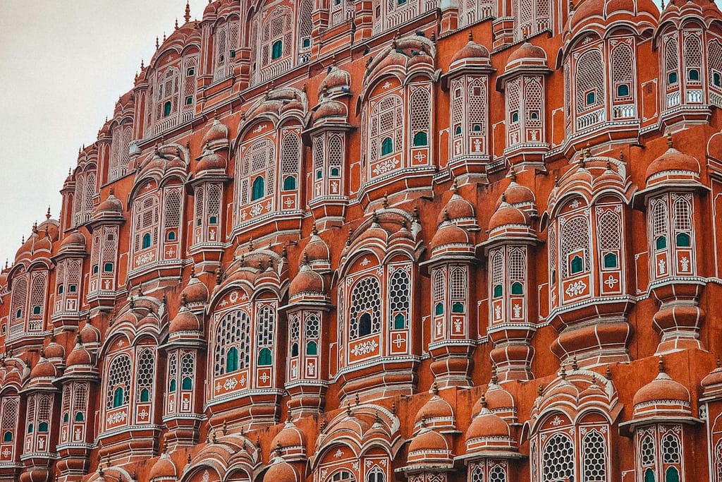 A very tall building with many windows and balconies.